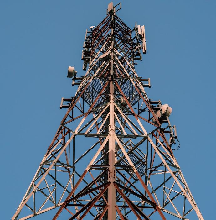 the top of a tower with multiple cell phones on it